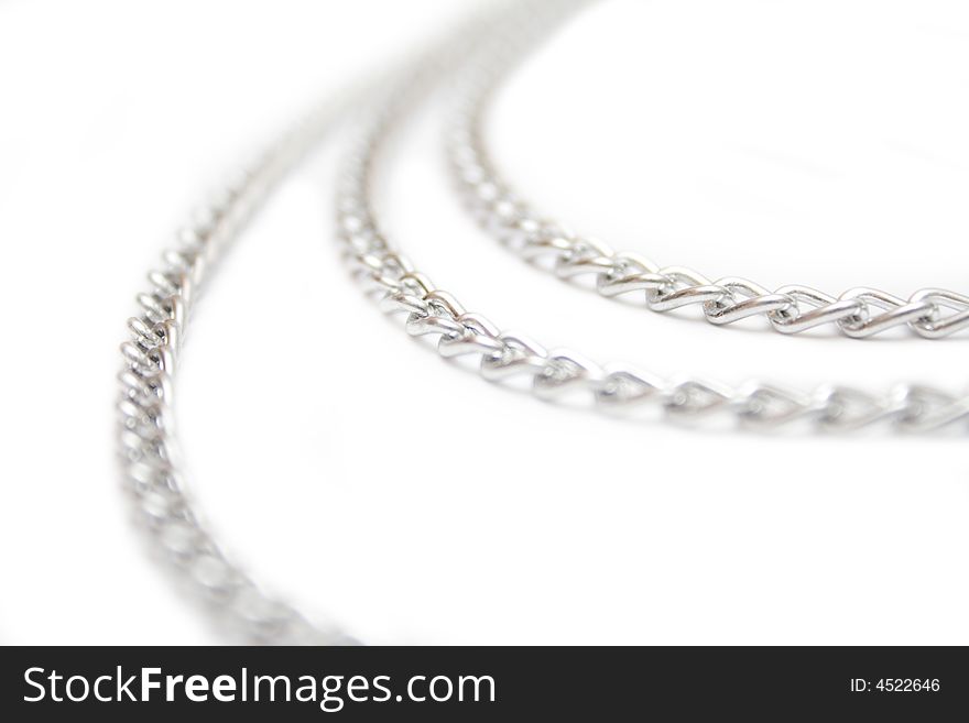 Fragment of silver chain on the white isolated background