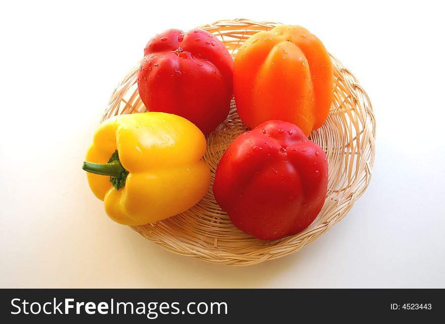 Multi-coloured pepper in basket. Multi-coloured pepper in basket.