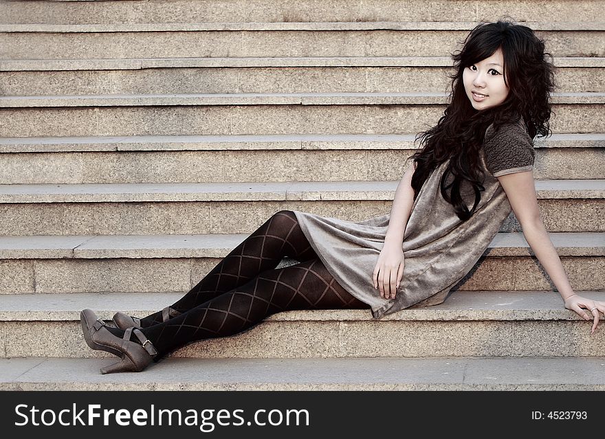 On the stair.A beautiful Chinese girl's artistic image. On the stair.A beautiful Chinese girl's artistic image.