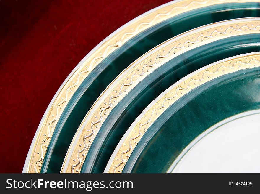 Pile of  plates isolated on red background