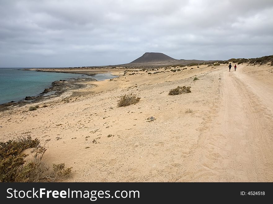 Walking towards Monta�a Amarilla in La Graciosa island, Canary Islands, Spain. Walking towards Monta�a Amarilla in La Graciosa island, Canary Islands, Spain