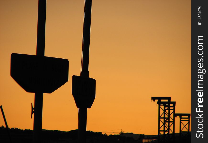 Two pillars at the harbor photographed in the sunset. Two pillars at the harbor photographed in the sunset