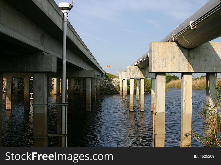 Highway bridge over the Saint John's River, Florida. Shot from Between one bridge and pipeline paralleling the road. Image is horizontal.