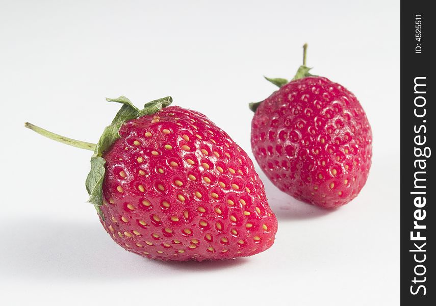 Two strawberry close up with white background