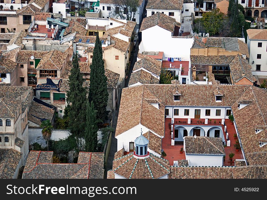 This European residential neighborhood in Granada, Spain is centrally divided and tightly squeezed by a narrow alleyway. This European residential neighborhood in Granada, Spain is centrally divided and tightly squeezed by a narrow alleyway.