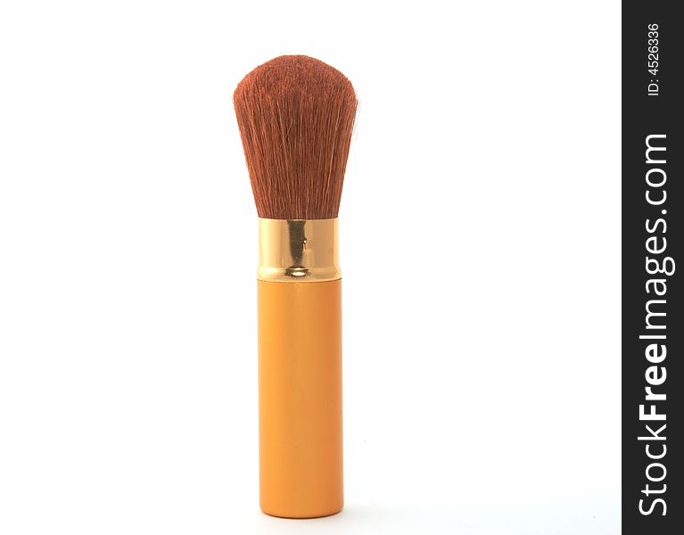 Soft cosmetic brush on a white background