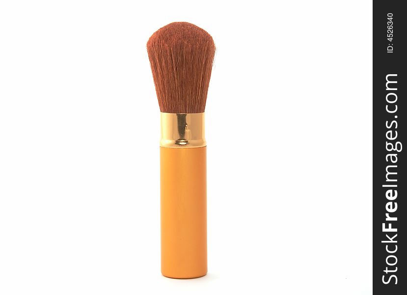 Soft cosmetic brush on a white background