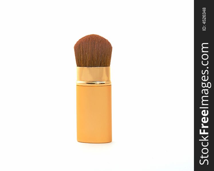 Soft cosmetic brush on a white background