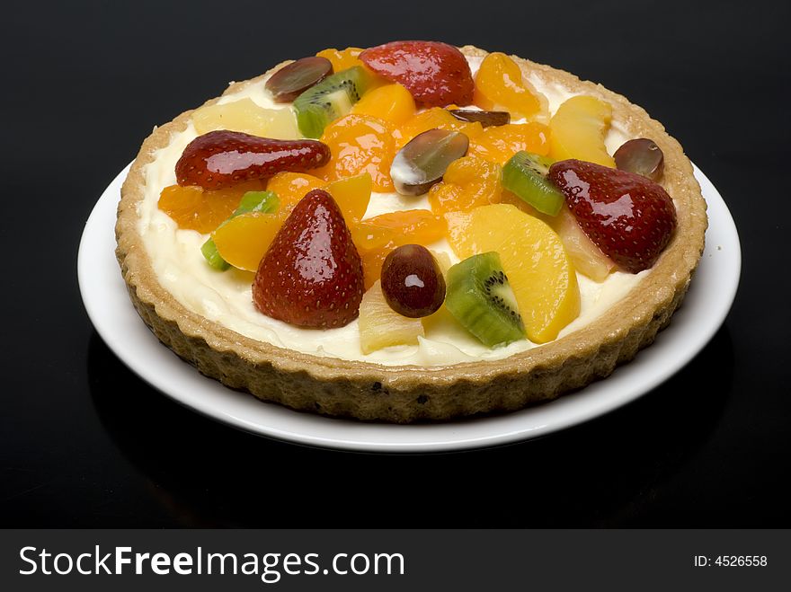 A fruit pie on a white plate