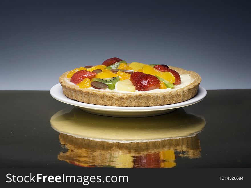 A fruit pie on a white plate