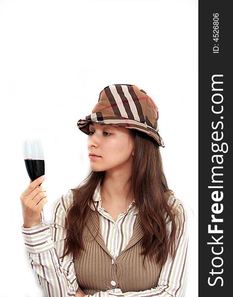 Woman in a casual dress with hat having a glass of wine