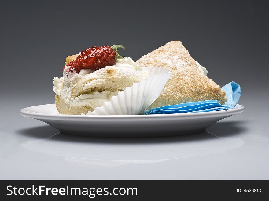 Cream pies on a plate on transparent gray background