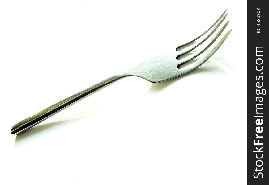 Fork on white background, high-key. Fork on white background, high-key