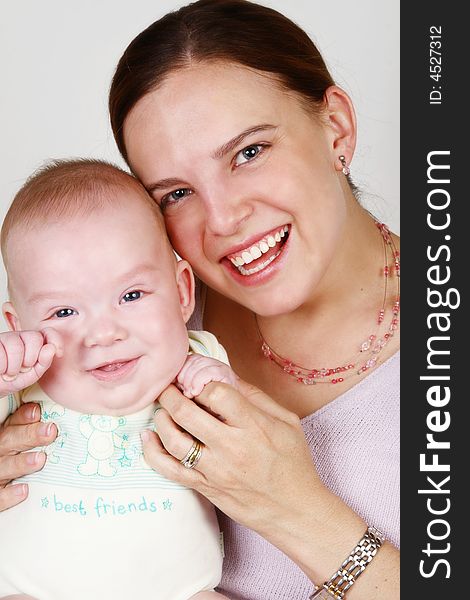 Smiling Mother and Baby on a white background. Smiling Mother and Baby on a white background