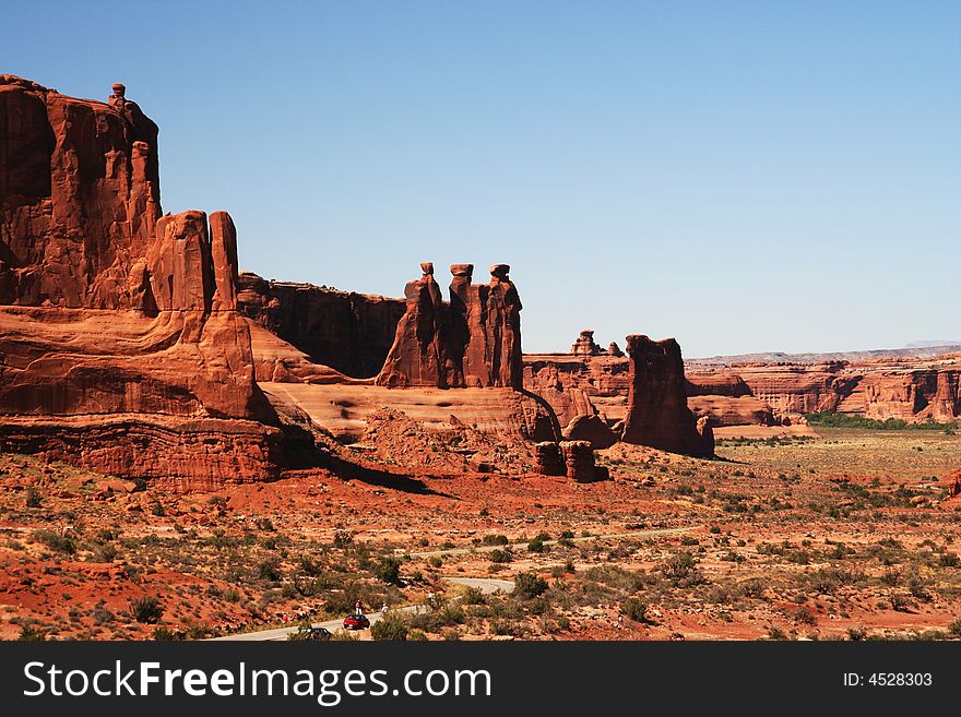 View on Three gossips and road around in Arches NP. View on Three gossips and road around in Arches NP