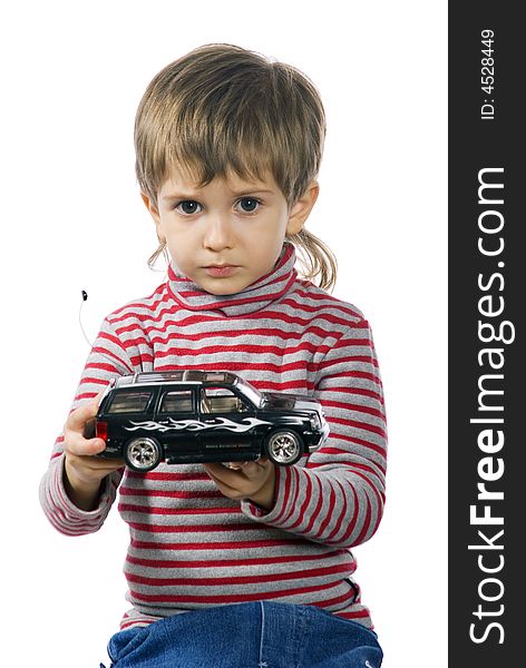 Little boy plays with his black toy car. Little boy plays with his black toy car