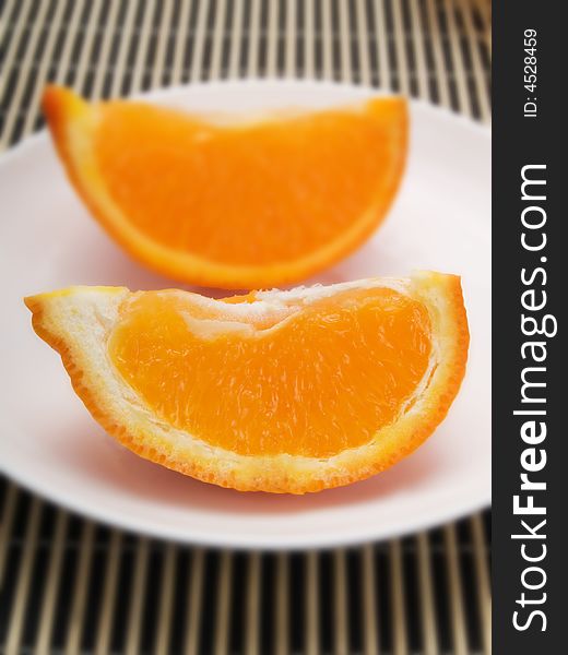 Orange slice on  a white plate