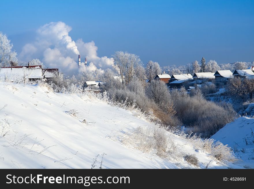 Rural winter landscape with smoking tubing