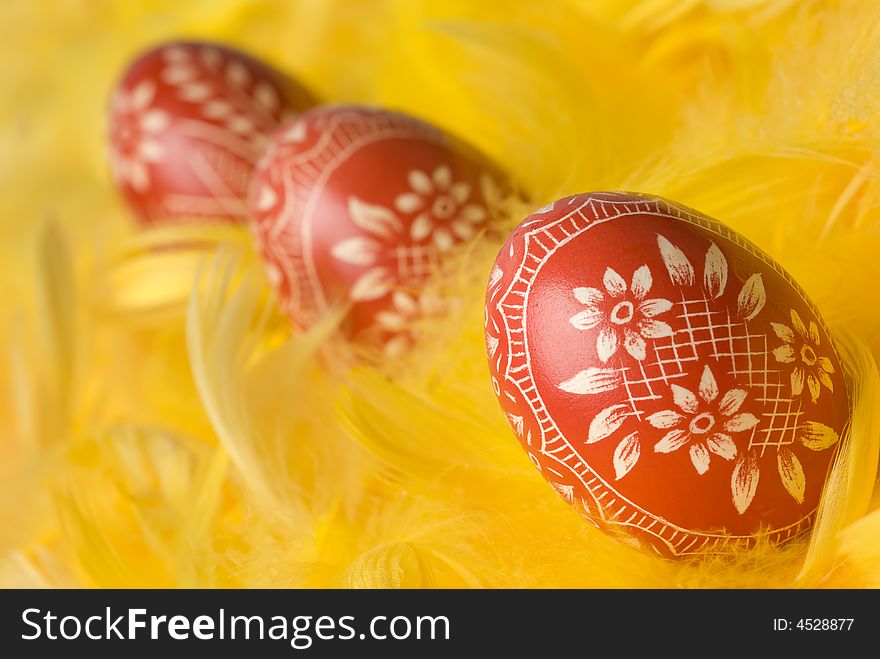 Three handmade easter eggs - selective focus on the first one. Three handmade easter eggs - selective focus on the first one.