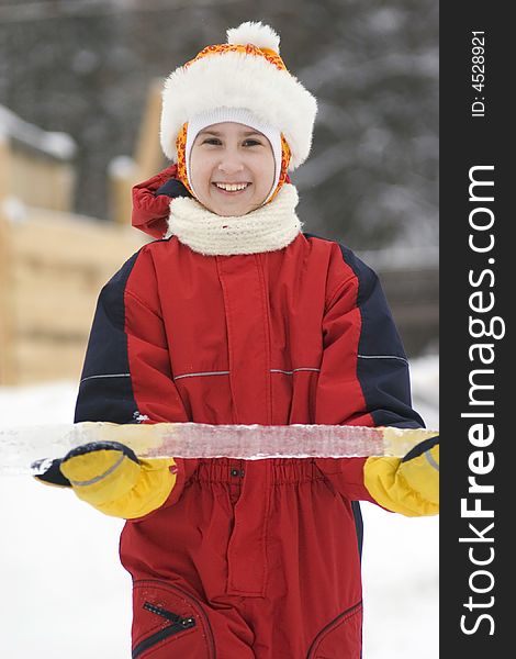 Happy girl with ice in snow suit