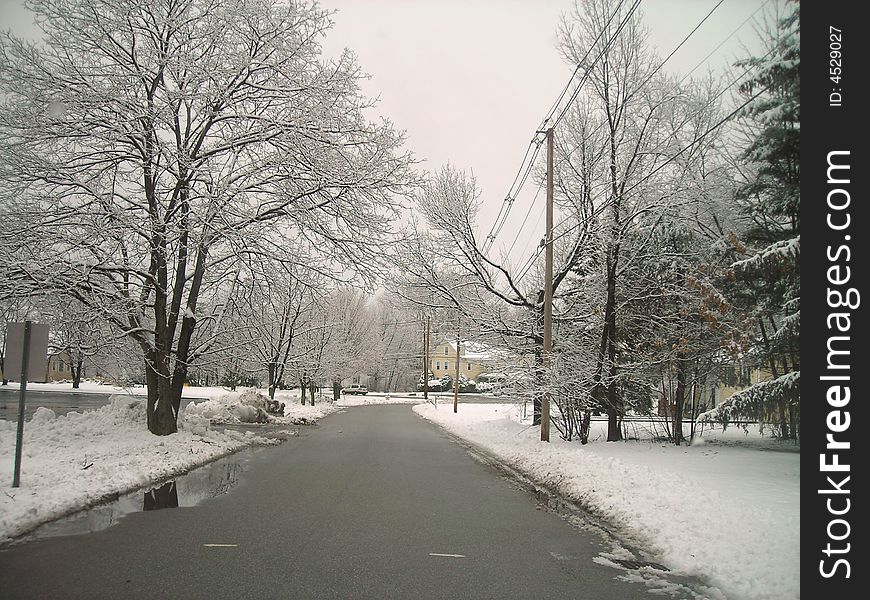 A snow covered road in Massachusetts. A snow covered road in Massachusetts