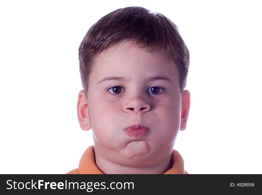 The little boy has typed air and has inflated cheeks. The little boy has typed air and has inflated cheeks