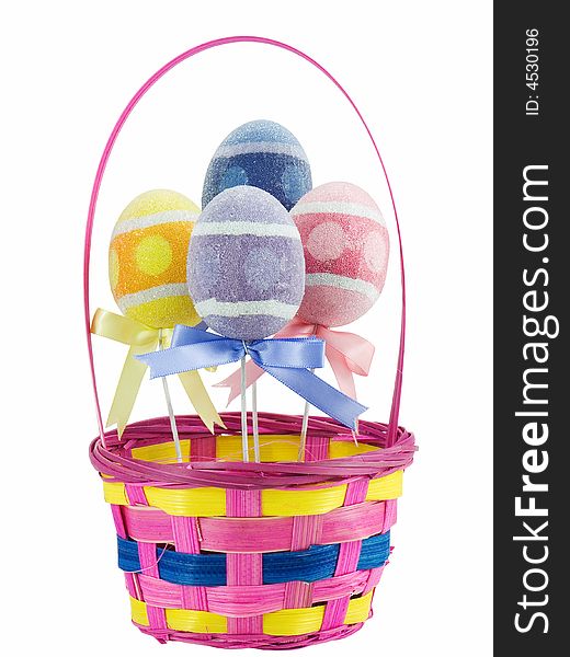 Easter basket with colored eggs in it, isolated on white. Easter basket with colored eggs in it, isolated on white
