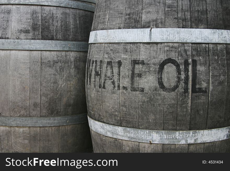 Horizontal image of 2 old wooden barrels of oil