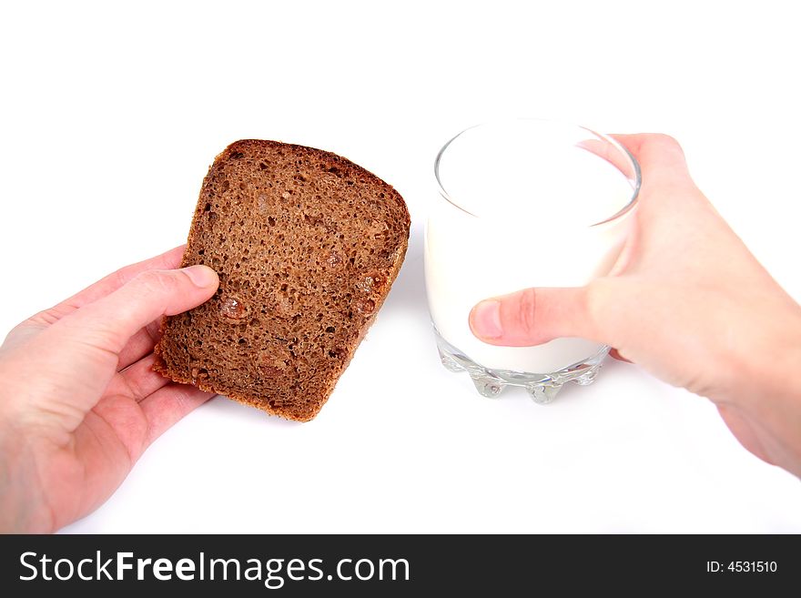 Bread and glass of milk. White background. Bread and glass of milk. White background.