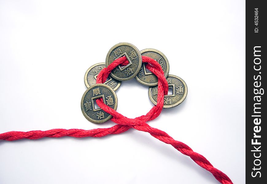 Five chinese Qing dynasty ancient coins chained with a red cord. Five chinese Qing dynasty ancient coins chained with a red cord