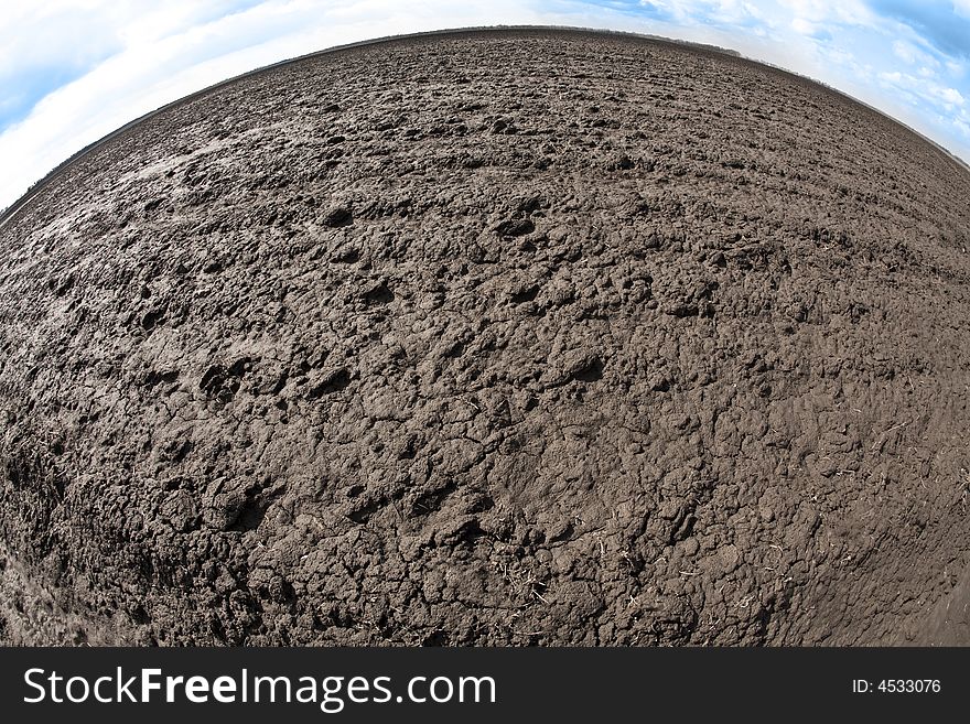 Agriculture theme: fish eye view of plough land