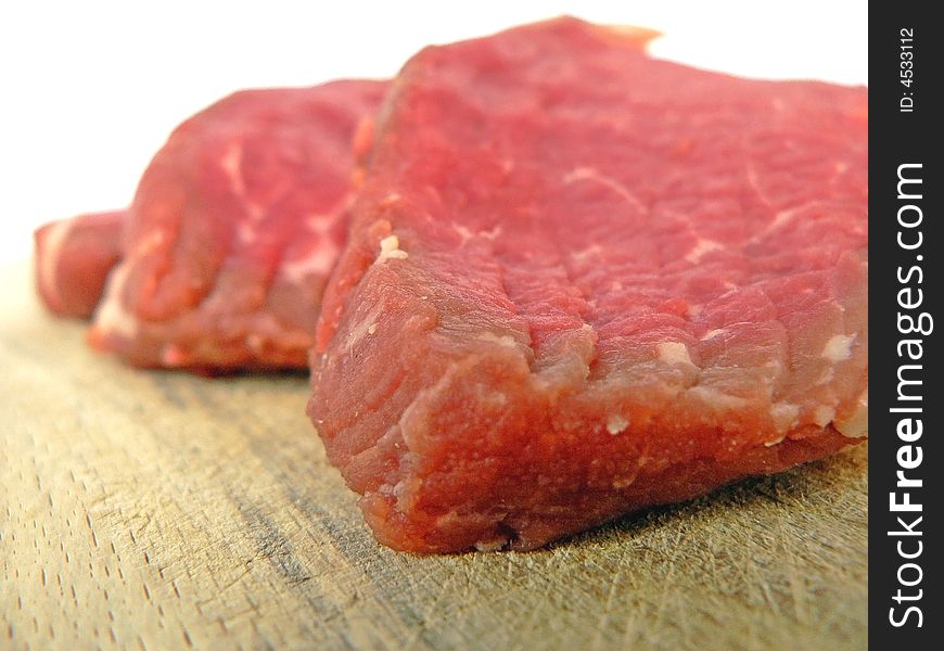 Three pieces of fresh healthy juicy raw meat. Three pieces of fresh healthy juicy raw meat.