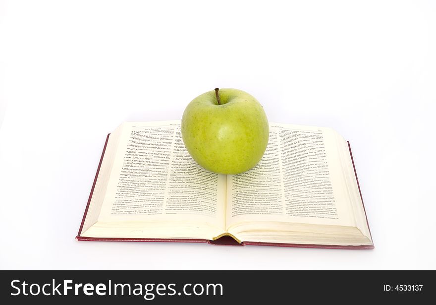 Green apple and stack of book. Green apple and stack of book