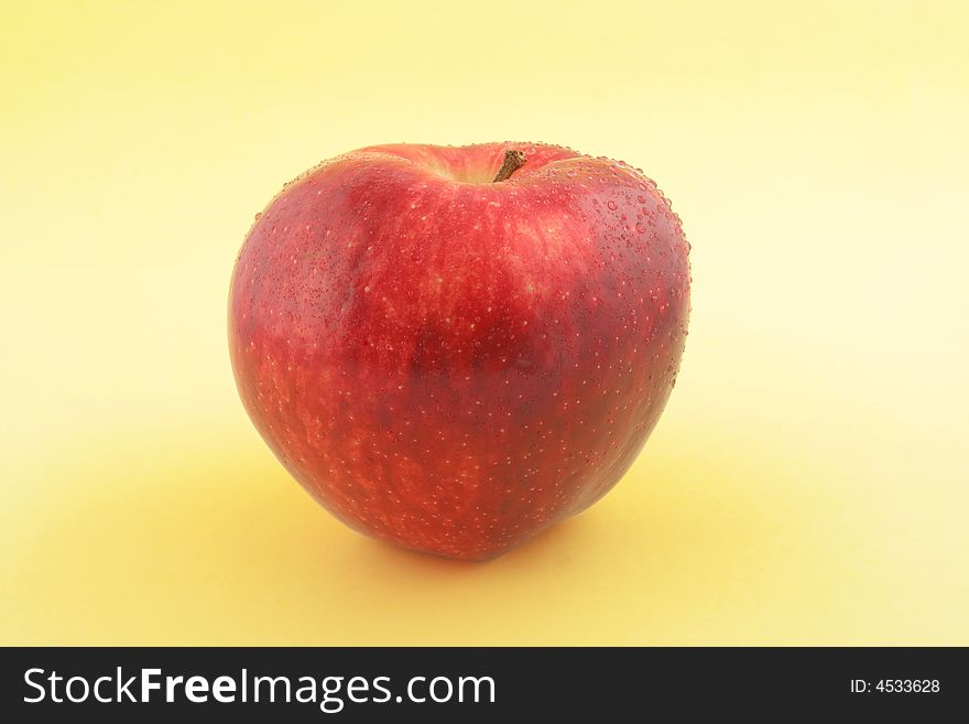 Red Apple on gradual yellow background