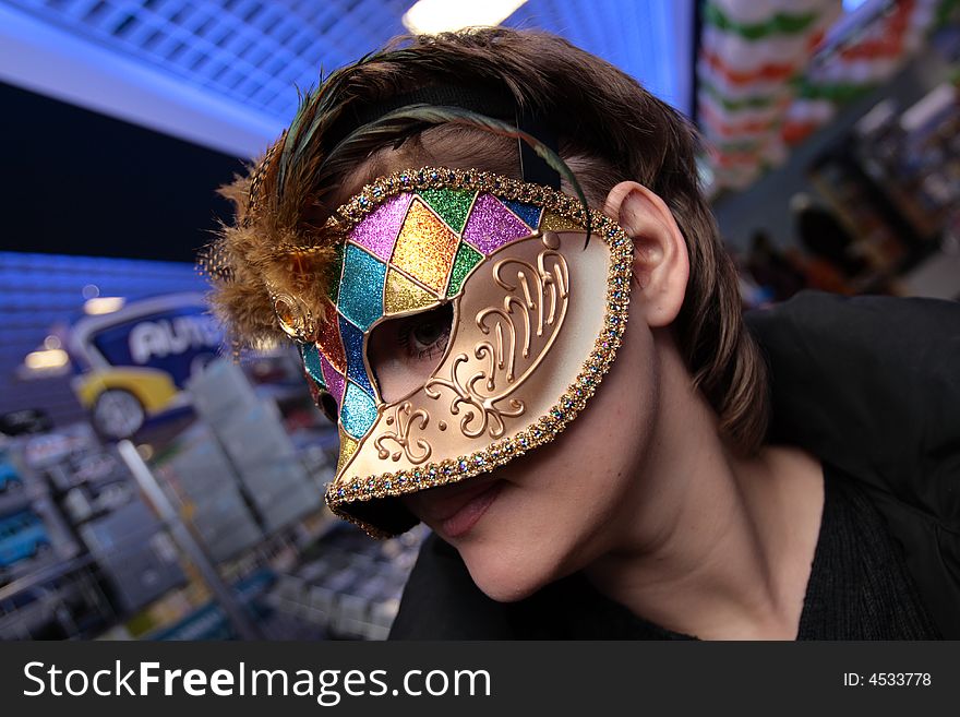 The woman in the carnival mask, indoor