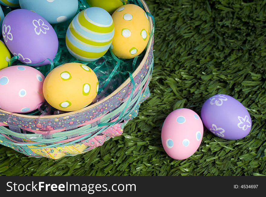 Brightly colored Easter eggs in a basket. Brightly colored Easter eggs in a basket
