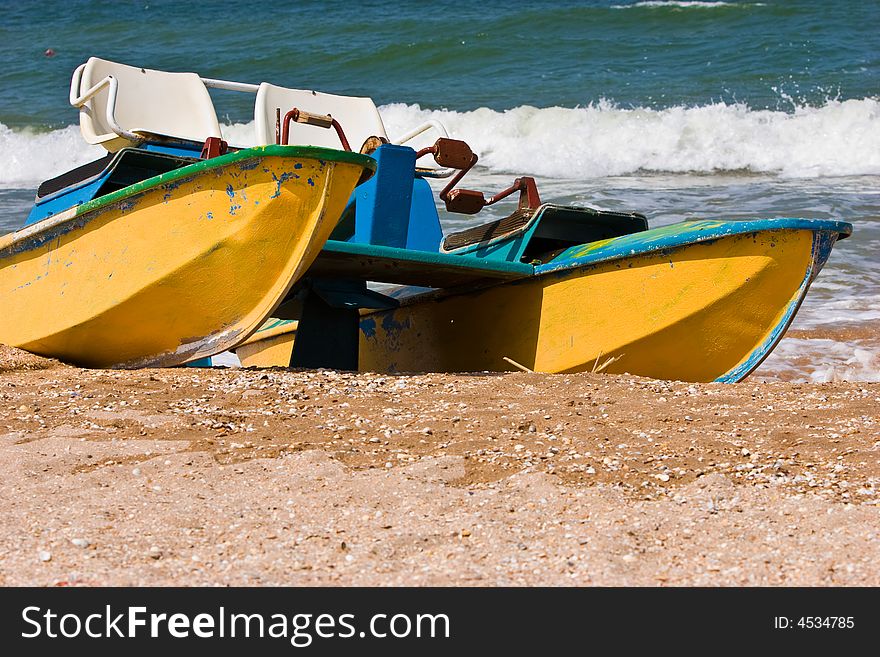 Leisure series: promenade catamaran on the beach of stormy sea. Leisure series: promenade catamaran on the beach of stormy sea