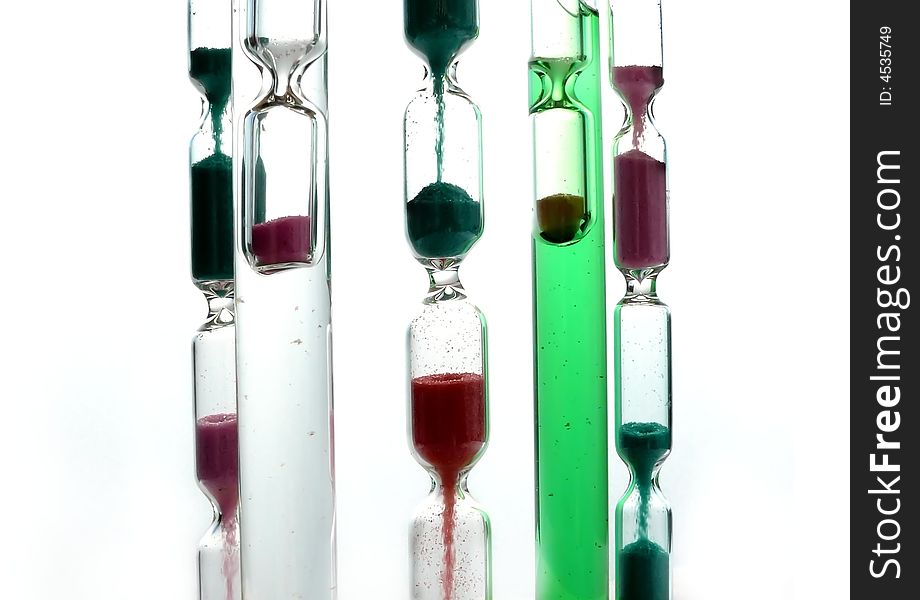 Colorful hourglasses on white background