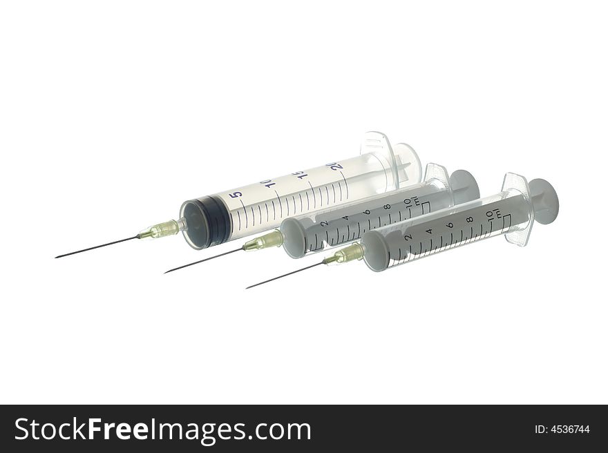 Three medical Syringes with needles isolated on white