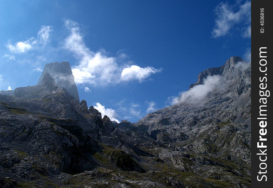 Silhouette of Picu Urriellu with clouds