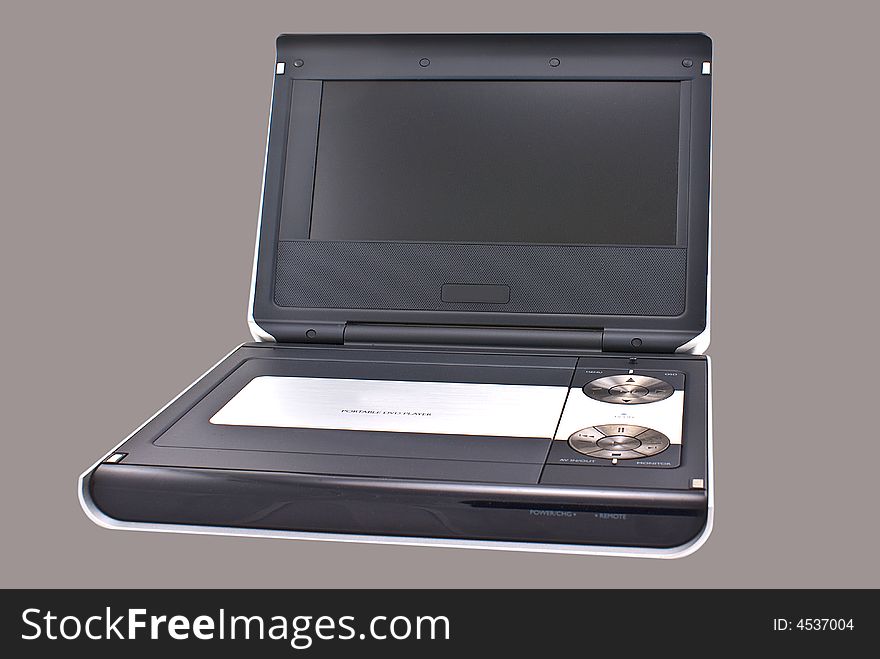 Portable DVD player isolated on colored background.