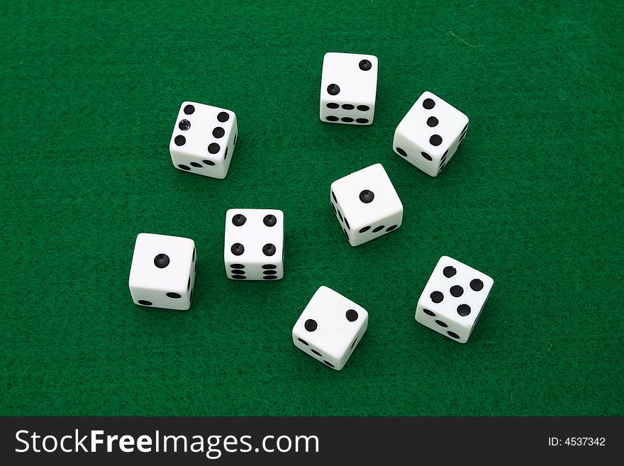 Several dice over a green table. Several dice over a green table