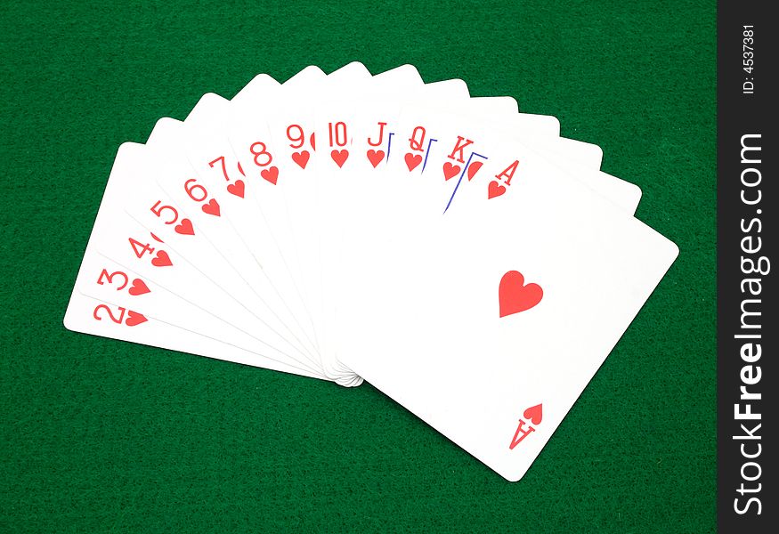 full set of heart cards over a green surface. full set of heart cards over a green surface
