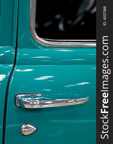 Green pickup truck body with chrome door handle and lock. Green pickup truck body with chrome door handle and lock.