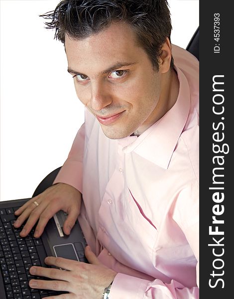 A man, sitting, with his laptop computer on his knees, smiling. A man, sitting, with his laptop computer on his knees, smiling