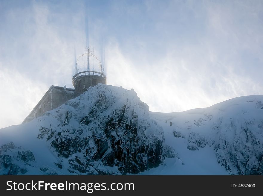 Shelter on the mountain peak during blizzard taken from down. Kasprowy Wierch, Tatry, Zakopane. Shelter on the mountain peak during blizzard taken from down. Kasprowy Wierch, Tatry, Zakopane