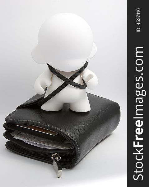 An abstract character tied to a wallet. An abstract character tied to a wallet.