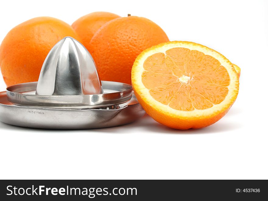 Close up of fresh oranges and a squeezer. Close up of fresh oranges and a squeezer