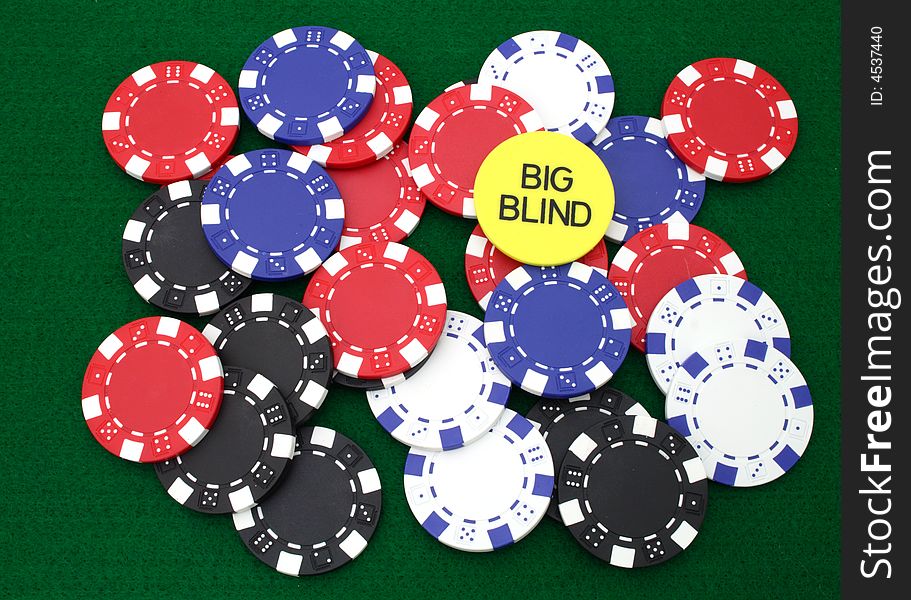 Colorful gambling chips over a green table. Colorful gambling chips over a green table
