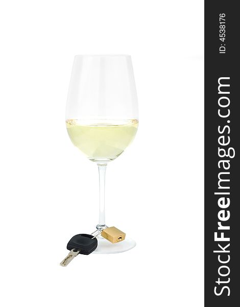 Shot of a wine glass against white with a car key locked to the glass stem as a wine charm. Shot of a wine glass against white with a car key locked to the glass stem as a wine charm.